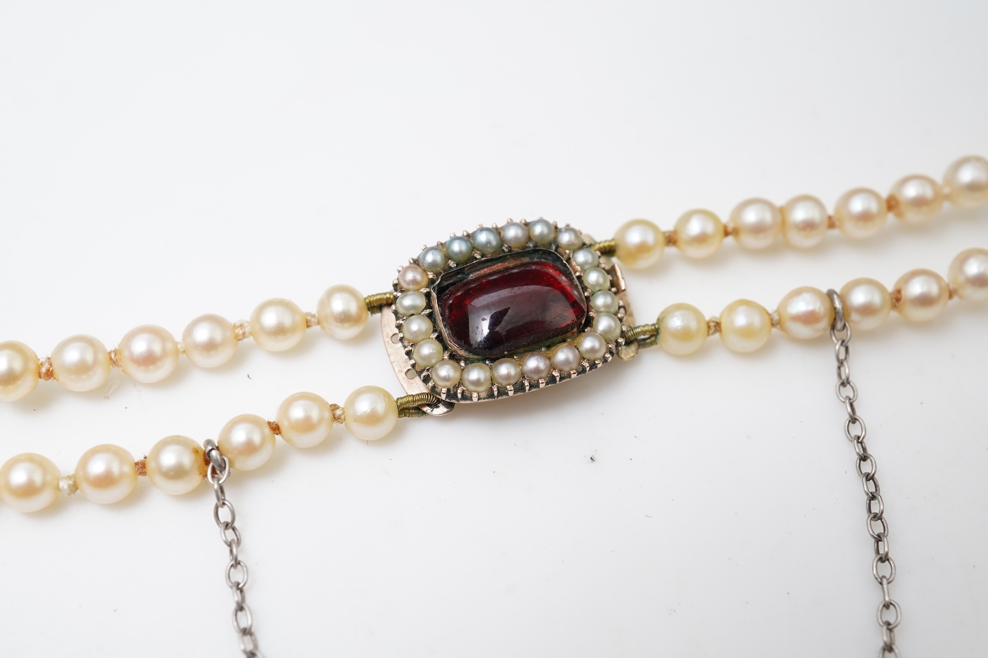 A cultured pearl and garnet necklace, 19th century and later
